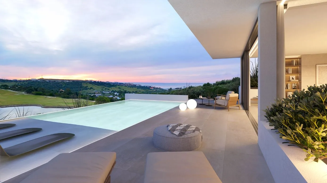 Modern villa terrace with stylish outdoor furniture and panoramic sea views on the Costa del Sol – a perfect setting for Mediterranean living.